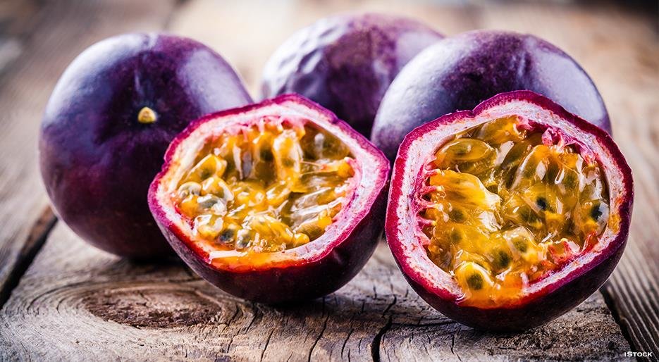 Fresh purple passion fruit harvested in Kenya showing deep purple skin and round shape, grown at high altitude for premium quality