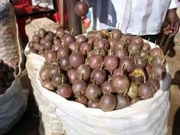 Kenya market vendors selling passion fruits at various price points
