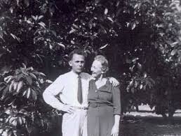 Portrait of Rudolph Hass next to his original avocado tree in La Habra Heights California showing the distinctive bumpy-skinned fruit