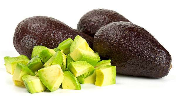 Close up of Golden Hass avocado skin showing shiny glossy surface texture compared to matte rough Original Hass skin identification